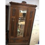 A MAHOGANY WARDROBE WITH BEVELLED GLASS FRONTED DOOR