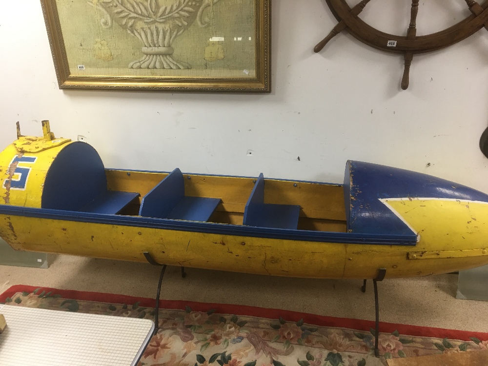 A VINTAGE YELLOW AN BLUE FIBREGLASS AND WOOD FAIRGROUND ROCKET RIDE 1950'S LENGTH 252CMS - Image 2 of 3