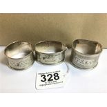 THREE MID CENTURY SILVER NAPKIN RINGS, TWO WITH ENGRAVED FLORAL DECORATION, THE OTHER ENGINE TURNED,
