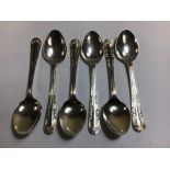 A SET OF SIX SILVER TEASPOONS WITH FLORAL MOTIF ADORNED HANDLES, HALLMARKED BIRMINGHAM 1930 BY