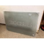 A 1930'S ETCHED GLASS PANEL (GROCERIES) 73 X 51CMS