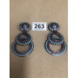 A PAIR OF ZOE COSTE DROP EARRINGS OF CIRCULAR FORM INLAID WITH BLUE ENAMEL