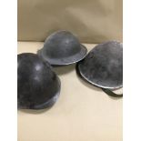 TWO MID CENTURY METAL MILITARY HELMETS AND ANOTHER MARKS POLICE