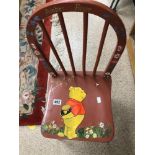 A CHILDS WINNIE THE POOH PAINTED WOODEN CHAIR