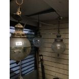 A SET OF THREE VICTORIAN ETCHED GLASS GLOBULAR HANGING CEILING LIGHTS ON GILT METAL MOUNTS