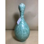 A CHINESE CELADON GREEN PORCELAIN VASE OF OVOID FORM WITH TAPERED NECK, DECORATED WITH SCENE