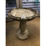 A RECONSTITUTED STONE BIRD BATH WITH ENGRAVED DECORATION, 46CM HIGH