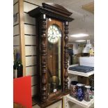 A 19TH CENTURY MAHOGANY VIENNA WALL CLOCK, THE ENAMEL DIAL WITH ROMAN NUMERALS DENOTING HOURS,