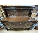 A CONTINENTAL BUFFET/SIDEBOARD WITH DROP HANDLES IN DARK OAK