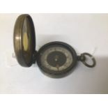 AN EARLY 20TH CENTURY BRASS CASED POCKET COMPASS "THE MAGNAPOLE" BY SHORT & MASON LTD