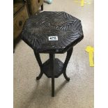 A HEAVY CARVED WOODEN TWO TIER SIDE TABLE