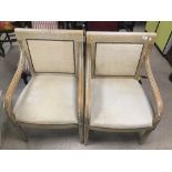 A PAIR OF MODERN CHAIRS WITH CREAM FABRIC