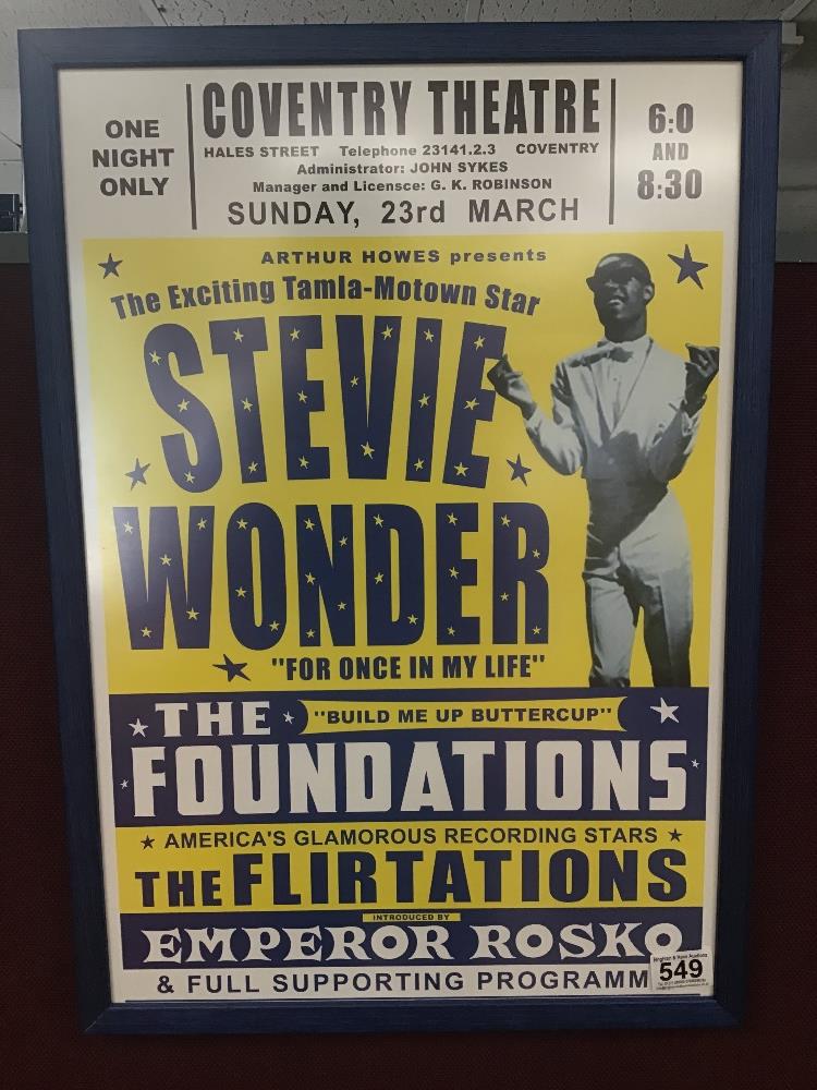 A FRAMED AND GLAZED REPRODUCTION POSTER OF A STEVIE WONDER TOUR