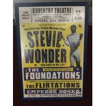 A FRAMED AND GLAZED REPRODUCTION POSTER OF A STEVIE WONDER TOUR
