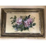 A LATE 19TH/EARLY 20TH CENTURY PAINTED GLASS PANEL OF ROSES, MOUNTED IN WORN GILT FRAME, 58CM