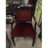 A RED VELVET BUTTON BACK ARMCHAIR