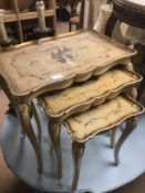A SET OF ITALIAN PAINTED NEST OF THREE TABLES PIE-CRUST TOPS