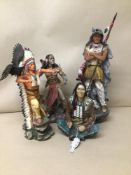 A GROUP OF FOUR RESIN FIGURES OF RED INDIANS