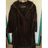 A VINTAGE BROWN THREE QUARTER LENGTH FUR COAT SIZE 14-16