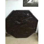 A LARGE WALL PLAQUE IN GESSO IN A HEXAGONAL SHAPE OF A DRAGON ORIGINALLY FROM THE ASTORIA IN