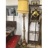A WOODEN GILDED STANDARD LAMP