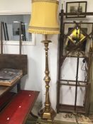 A WOODEN GILDED STANDARD LAMP