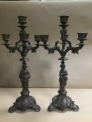 A PAIR OF LATE 19TH CENTURY CONTINENTAL SPELTER THREE BRANCH FOUR LIGHT CANDELABRA WITH FIGURAL