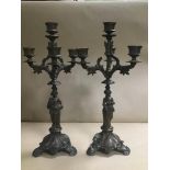 A PAIR OF LATE 19TH CENTURY CONTINENTAL SPELTER THREE BRANCH FOUR LIGHT CANDELABRA WITH FIGURAL