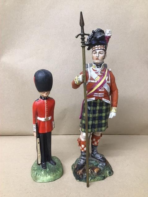 A COMMEMORATIVE CERAMIC FIGURE OF A SCOTTISH SOLDIER BY T.GOODE & CO FOR THE CENTENARY OF WATERLOO,