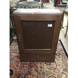 A FRENCH OAK WALL MOUNTED CUPBOARD