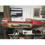A VINTAGE 1950'S RED FIBREGLASS AND WOOD FAIRGROUND ROCKET RIDE 252CMS