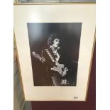 A FRAMED AND GLAZED LIMITED EDITION 233/500 PHOTOGRAPH OF JIM HENDRIX SIGNED 46 X 55CMS