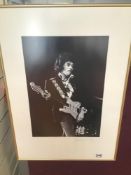 A FRAMED AND GLAZED LIMITED EDITION 233/500 PHOTOGRAPH OF JIM HENDRIX SIGNED 46 X 55CMS