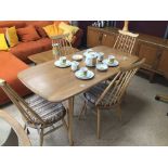 AN ERCOL TABLE WITH FOUR ERCOL CHAIRS