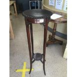 A ROSEWOOD PLANT STAND ON TURNED OUT LEGS 99CMS