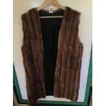 A VINTAGE LIGHT BROWN FUR, LONG WAISTCOAT SIZE 14-16