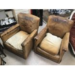 A PAIR OF ART DECO BROWN LEATHER CLUB CHAIRS 1930'S WITH STUDDED ARMS A/F