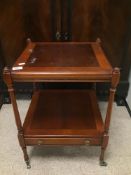 A VINTAGE WOODEN TWO TIER TABLE ON ORIGINAL CASTORS WITH DRAWER