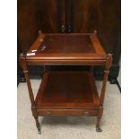 A VINTAGE WOODEN TWO TIER TABLE ON ORIGINAL CASTORS WITH DRAWER