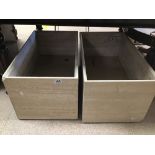 A PAIR OF MARBLE PLANTERS ON WHEELS 70 X 40 X 35CMS