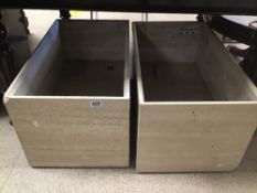 A PAIR OF MARBLE PLANTERS ON WHEELS 70 X 40 X 35CMS