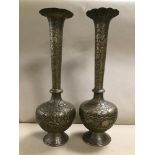 A PAIR OF LARGE INDIAN BRASS VASES WITH HAMMERED DECORATION THROUGHOUT DEPICTING ELEPHANTS AND OTHER