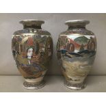 A PAIR OF JAPANESE SATSUMA POTTERY VASES, HIGHLY DECORATED THROUGHOUT WITH POLY-CHROME ENAMELS, 21CM