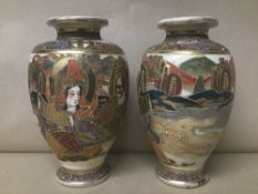 A PAIR OF JAPANESE SATSUMA POTTERY VASES, HIGHLY DECORATED THROUGHOUT WITH POLY-CHROME ENAMELS, 21CM