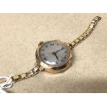 A MID CENTURY 9CT GOLD CASED WRISTWATCH, SWISS MADE 15 JEWEL MOVEMENT, THE SILVERED DIAL WITH