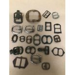 A COLLECTION OF EARLY BELT AND SHOE BUCKLES OF VARYING SHAPES AND DESIGNS