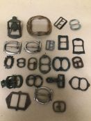 A COLLECTION OF EARLY BELT AND SHOE BUCKLES OF VARYING SHAPES AND DESIGNS