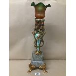 AN UNUSUAL TABLE LAMP WITH GILT PAINTED TWIN HANDLED URN RAISED UPON A SQUARE MARBLE BASE, UPON FOUR