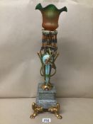 AN UNUSUAL TABLE LAMP WITH GILT PAINTED TWIN HANDLED URN RAISED UPON A SQUARE MARBLE BASE, UPON FOUR