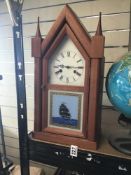 A MID CENTURY MANTLE CLOCK BY FRANZ HERMLE WITH PAINTED GLASS PANEL TO FRONT DEPICTING A SHIP AT
